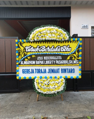 Papan Bunga Duka di Essang